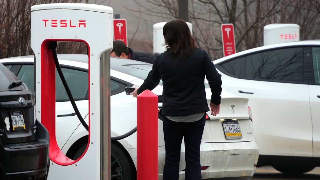 Tesla vehicles are charged at a Tesla charging station in Pittsburgh on Jan. 30. (AP Photo/Gene J. Puskar)