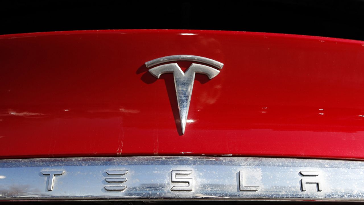 In this Feb. 2, 2020, file photo, the Tesla company logo is shown in Littleton, Colo. Tesla is recalling nearly all of the vehicles it has sold in the U.S. because some warning lights on the instrument panel are too small. Documents posted Friday, Feb. 2, 2024 by U.S. safety regulators say the recall will be done with an online software update. (AP Photo/David Zalubowski, File)