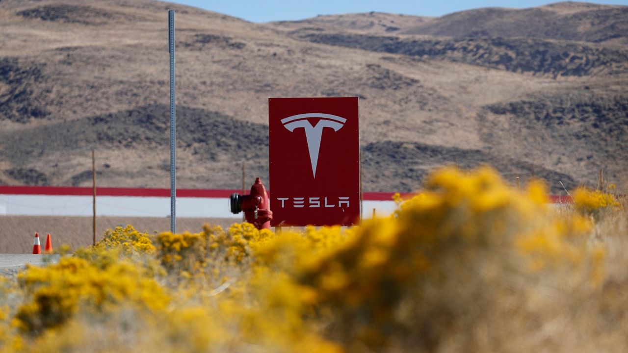 A sign marks the entrance to the Tesla Gigafactory in Sparks, Nev. (AP Photo/John Locher)