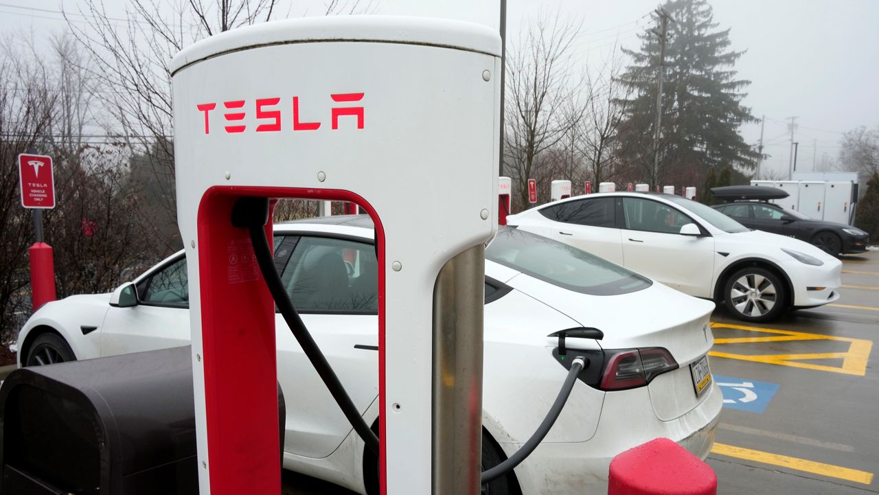 Tesla vehicles are charged at a Tesla charging station in Pittsburgh on Monday, Jan. 30, 2023. (AP Photo/Gene J. Puskar)