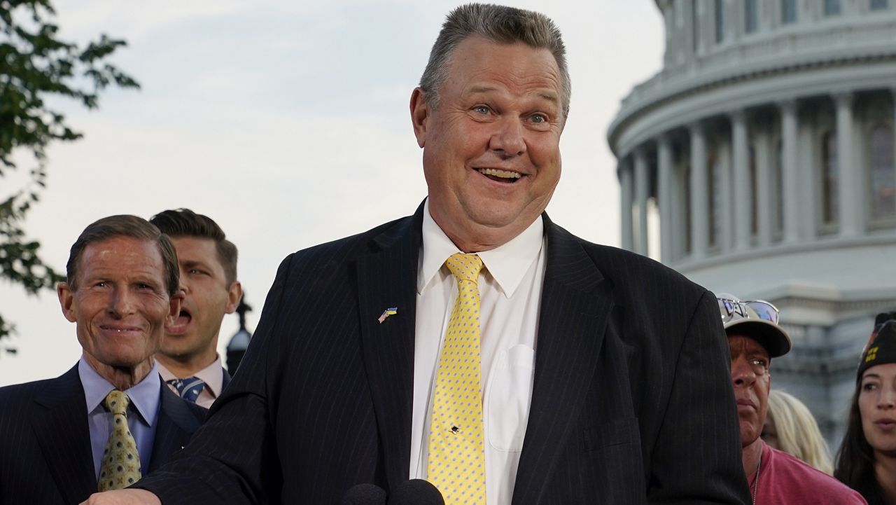 Sen. Jon Tester, D-Mont., speaks at a news conference alongside Sen. Richard Blumenthal, D-Conn., back left, on Aug. 2, 2022, on Capitol Hill in Washington. (AP Photo / Patrick Semansky)