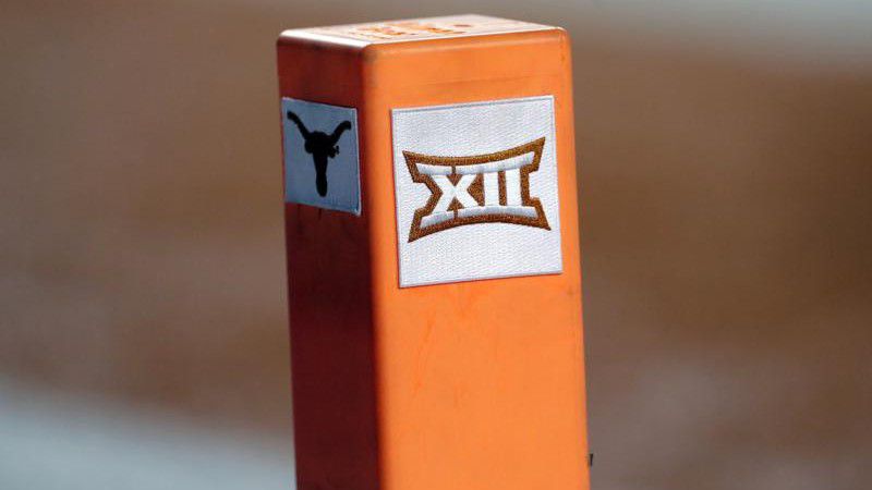 FILE - In this Sept. 15, 2018, file photo, the Big 12 conference logo is seen on a pylon during the first half of an NCAA college football game between Texas and USC in Austin, Texas. Texas and Oklahoma made a request Tuesday, July 27, 2021, to join the Southeastern Conference — in 2025 —- with SEC Commissioner Greg Sankey saying the league would consider it in the “near future.” (AP Photo/Eric Gay, File)