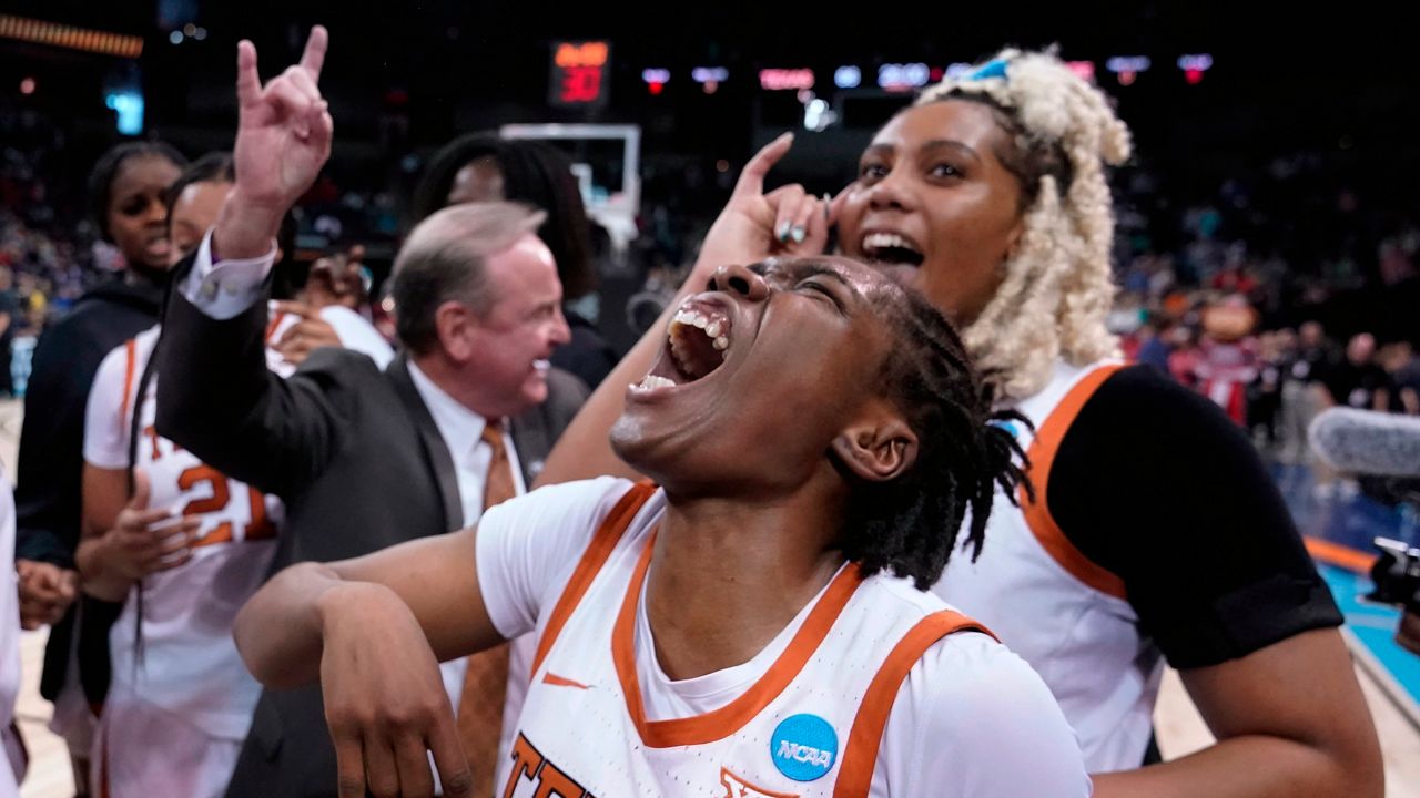 Texas guard Joanne Allen-Taylor, center, reacts after Texas beat Ohio State 66-63 in a college basketball game in the Sweet 16 round of the NCAA tournament, Friday, March 25, 2022, in Spokane, Wash. (AP Photo/Ted S. Warren)