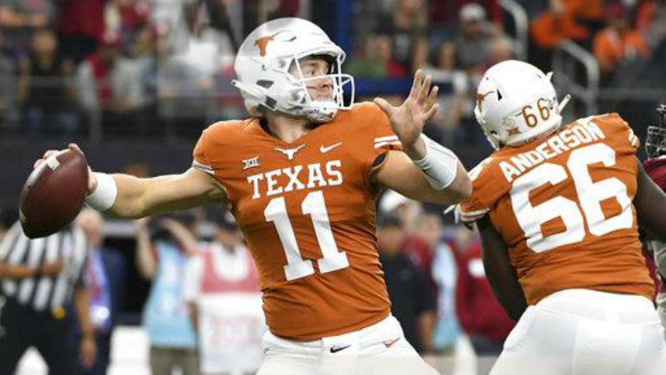 Texas quarterback Sam Ehlinger (11) throws a pass against Oklahoma during the first half of the Big 12 Conference championship NCAA college football game on Saturday, Dec. 1, 2018, in Arlington, Texas. (AP Photo/Jeffrey McWhorter)