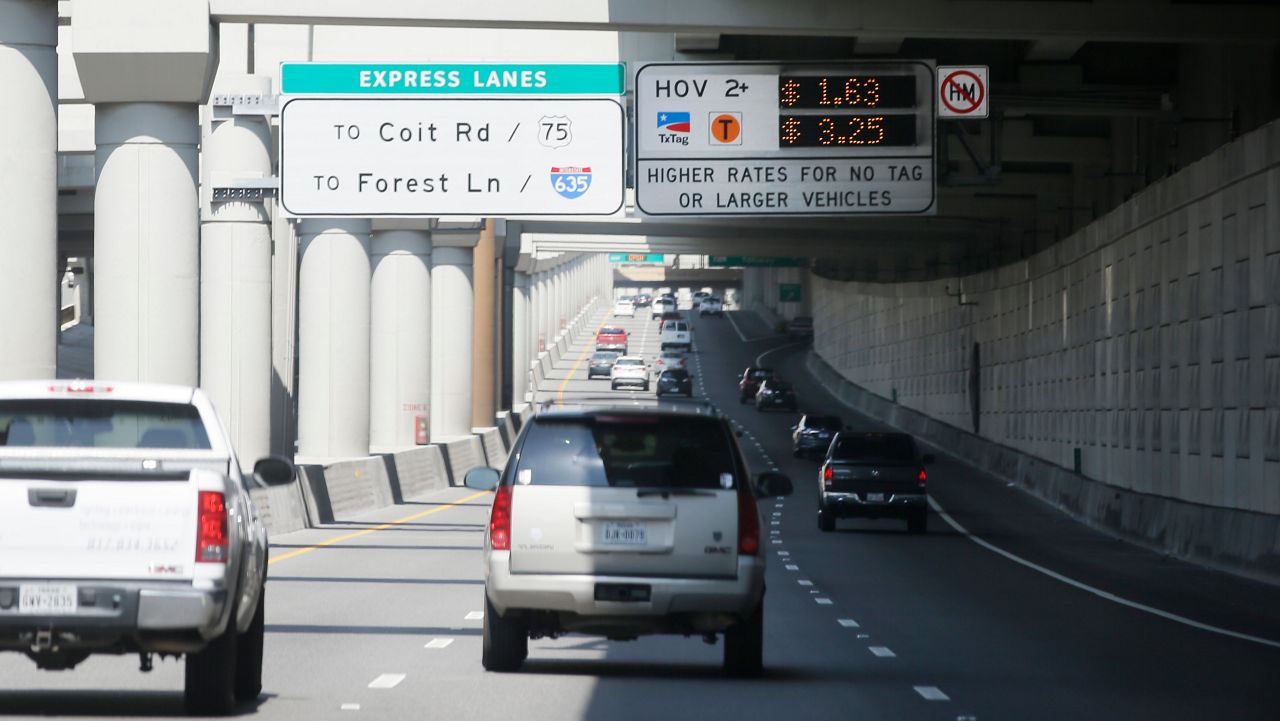 A sign tells drivers of the rate to drive on a toll road in Dallas. (AP Photo/LM Otero)