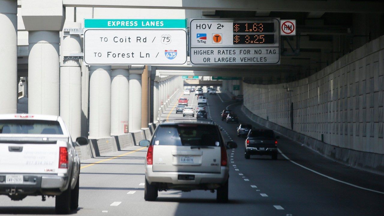 A sign tells drivers of the rate to drive on a toll road in Dallas, Thursday, Aug. 10, 2017. (AP Photo/LM Otero)