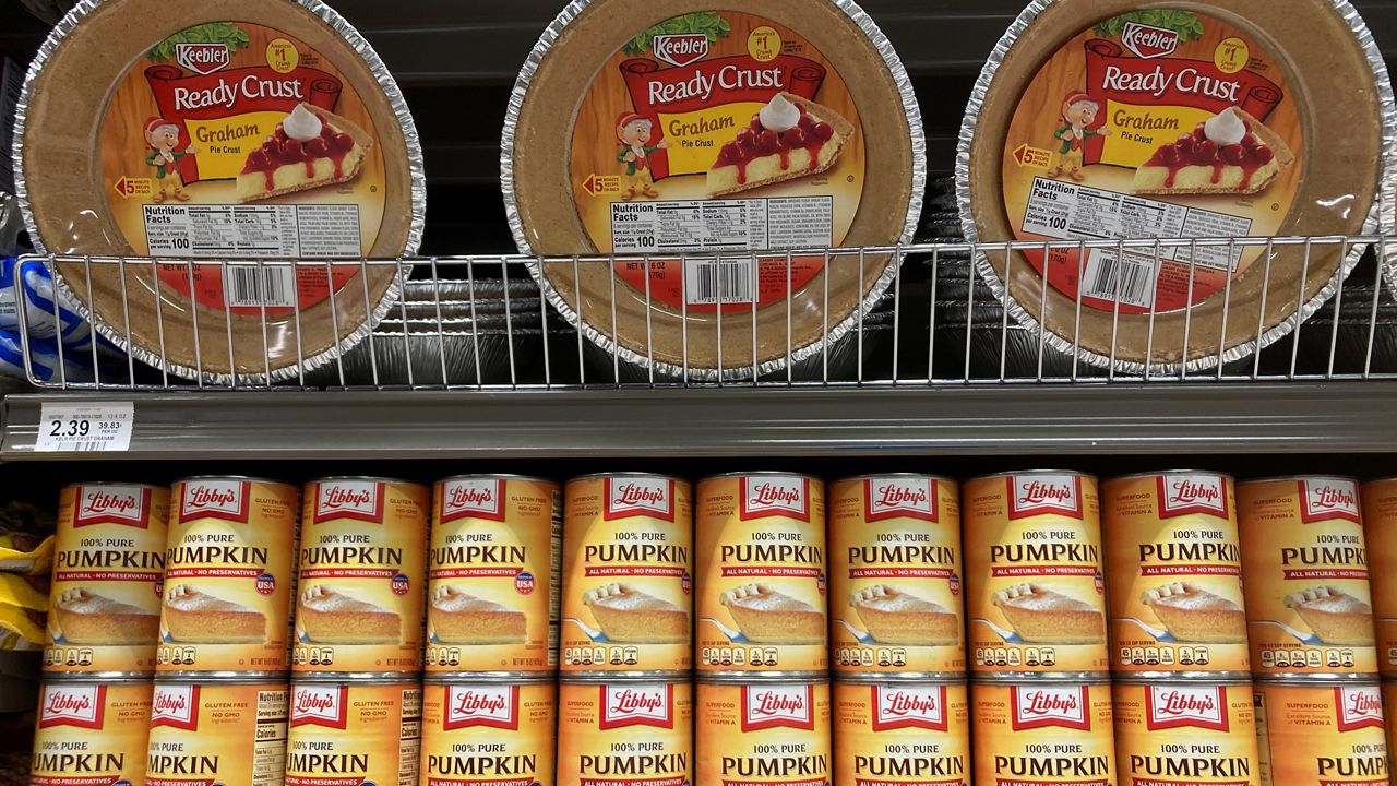 Canned pumpkin and graham cracker shell crusts are for sale at a Publix Supermarket, Tuesday, Nov. 16, 2021 in North Miami, Fla. (AP Photo/Marta Lavandier)
