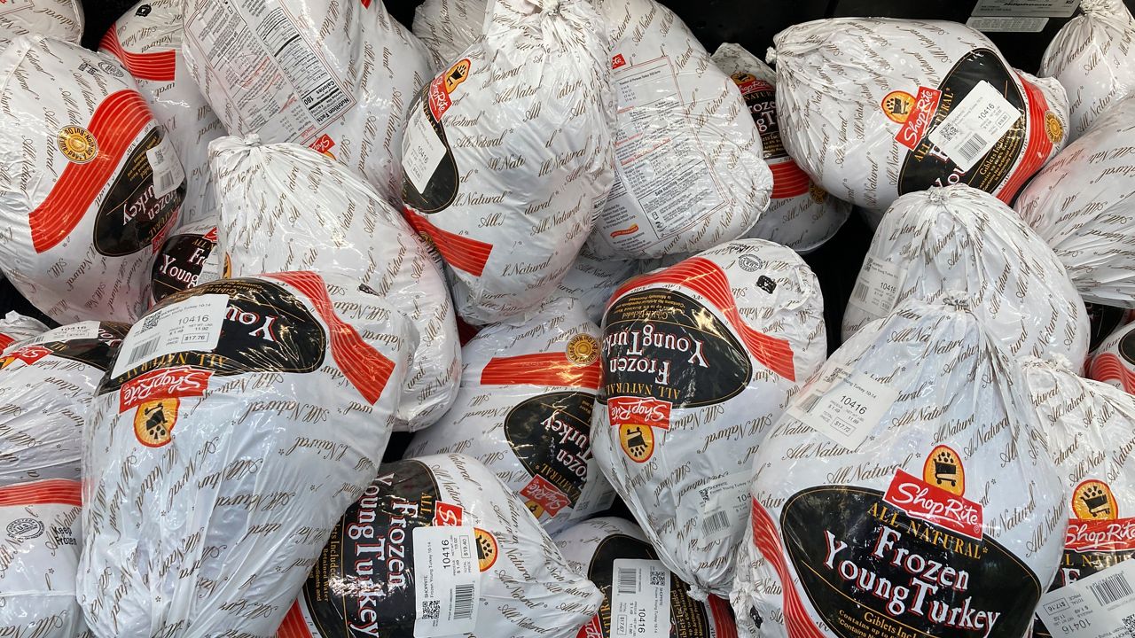 Frozen turkeys are displayed at a supermarket in Philadelphia, Wednesday, Nov. 17, 2021. (AP Photo/Matt Rourke, File)