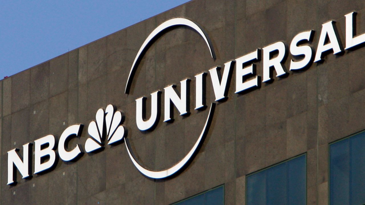 This Dec. 3, 2009, photo, the NBC Universal logo hangs on a building in Los Angeles. (AP Photo/Jae C. Hong, File)