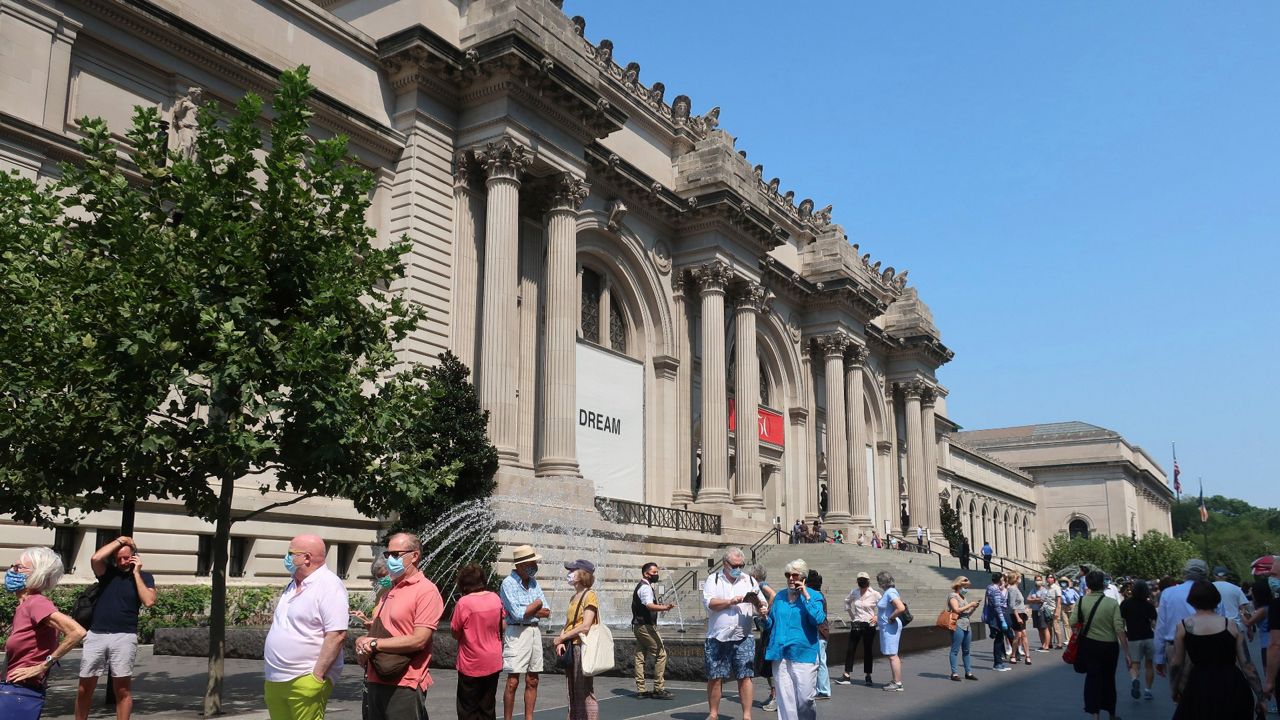 People lined up outside the Metropolitan Museum of Art in Manhattan in August 2020, when the museum first reopened its doors after closing due to the pandemic. (AP Photo/Ted Shaffrey)
