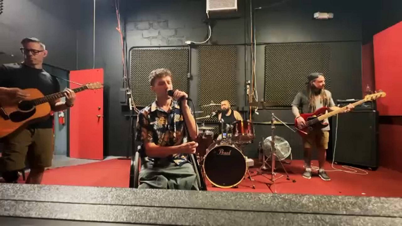 Members of the rock band The Resilient gather for a rehearsal. (Spectrum News/Matt Lackritz)