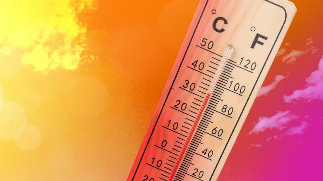 graphic photo of a thermometer reaching into the 90s with a hot-looking sky behind it