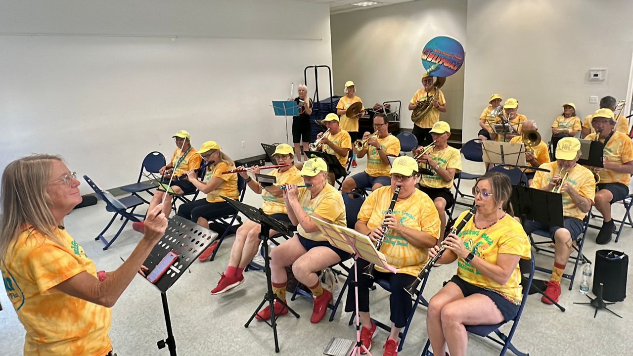 The Gulfport Gecko Amalgamated Marching Band rehearses for WMNF 88.5's Tropical Heatwave Musical Festival. (Spectrum News/Virginia Johnson)