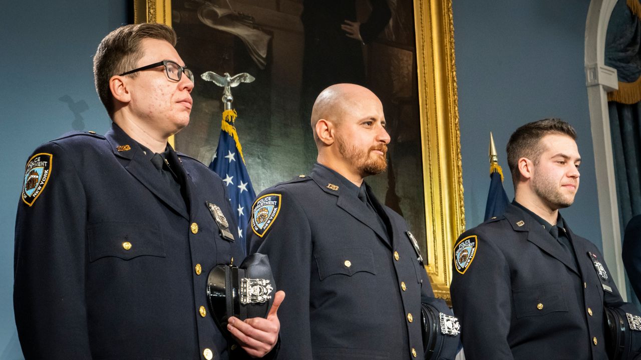Officers Paul Cozzolino, Mickel Hanna and Louis Iorio are pictured at City Hall on Wednesday April 5, 2023.