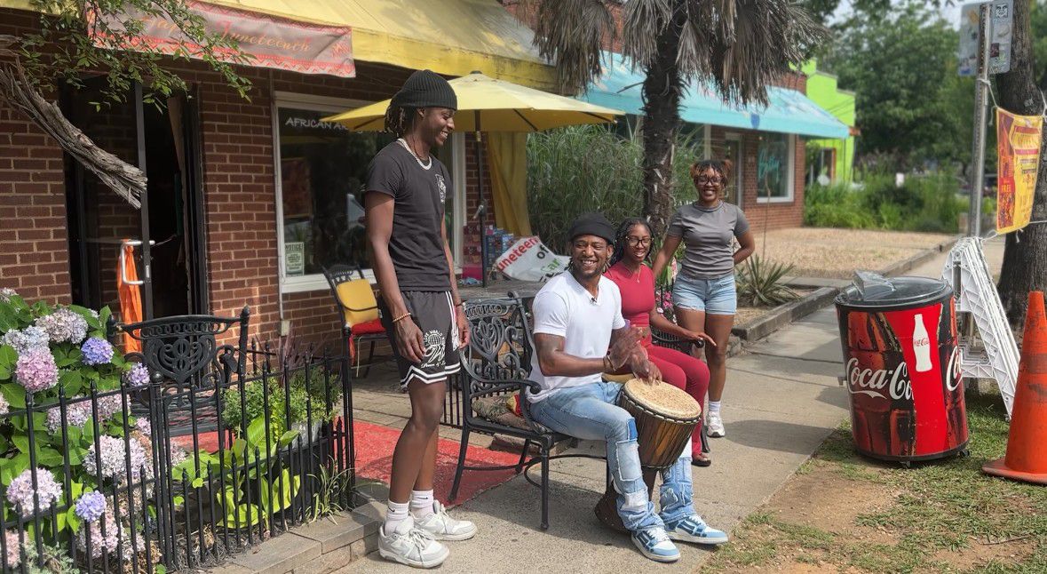 Drummer Akinyomi Courtney, center, is enjoying time with his loved ones. They'll be performing together Friday at the Juneteenth Festival of the Carolinas, during the Drum Circle. (Spectrum News 1/Jennifer Roberts) 