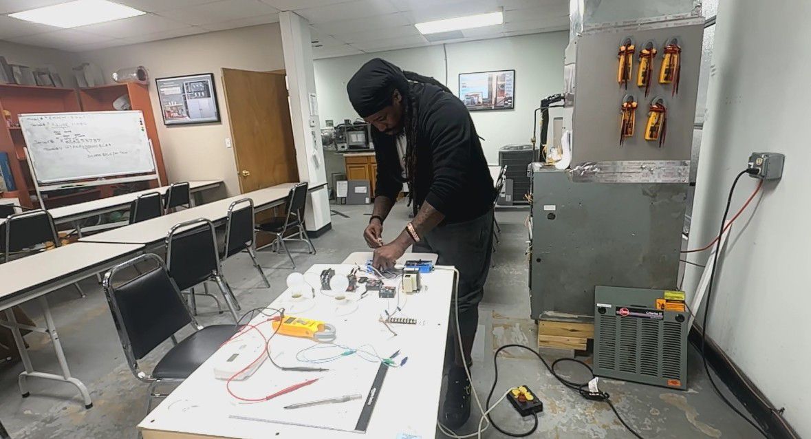 Dorian Torrence is working on a project at NCIA Vocational Training Center in Charlotte. Torrence enrolled to get a fresh start after incarceration. (Spectrum News 1/Jennifer Roberts)