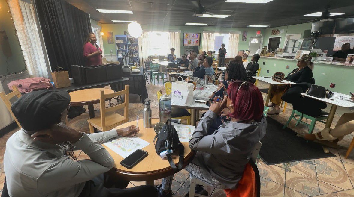 Mecklenburg County residents attend the Love in Action Cafe for a free nutrition and cooking class. The chef, Ini Isangedighi, is teaching how to prepare plant-based meals. (Spectrum News 1/Jennifer Roberts)