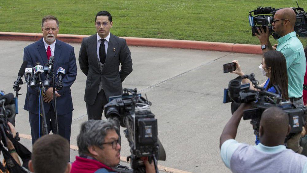 Victor Hugo Cuevas, a 26-year-old linked to a missing tiger named India, and his attorney Michael Elliott, left, talk to reporters before entering Fort Bend County Justice Center for a bond revocation hearing on a separate murder charge, on Friday, May 14, 2021, in Richmond, Texas. (Godofredo A. Vásquez/Houston Chronicle via AP)