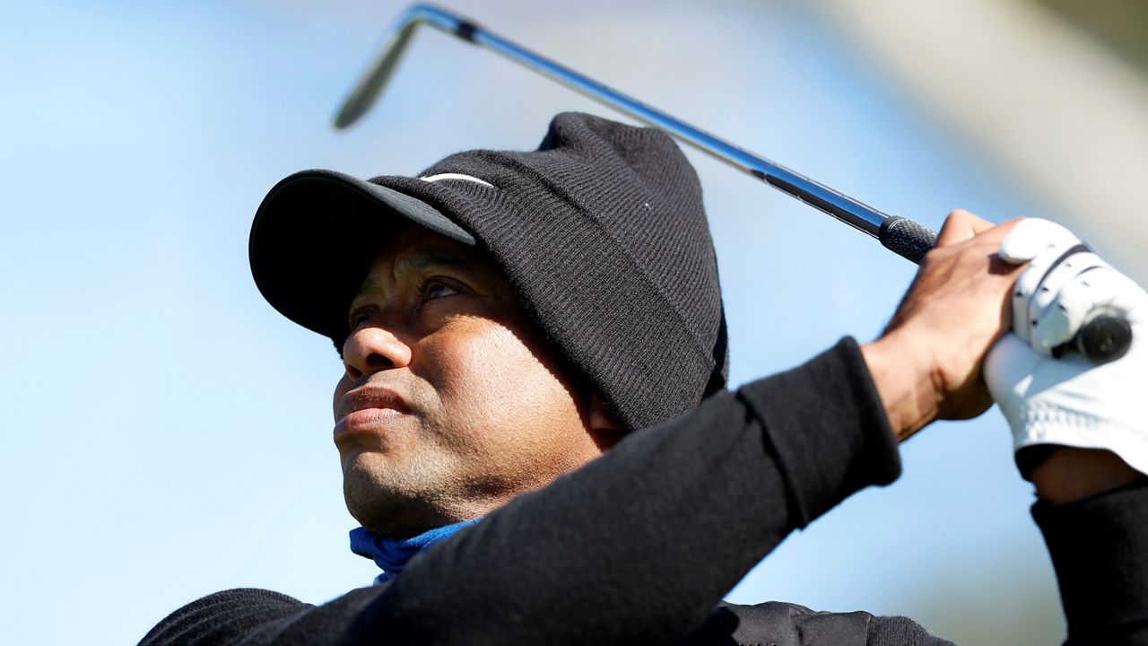 Tiger Woods watches his tee shot on the 16th hole during the pro-am of the Genesis Invitational golf tournament at Riviera Country Club, Wednesday, Feb. 15, 2023, in the Pacific Palisades area of Los Angeles. (AP Photo/Ryan Kang)