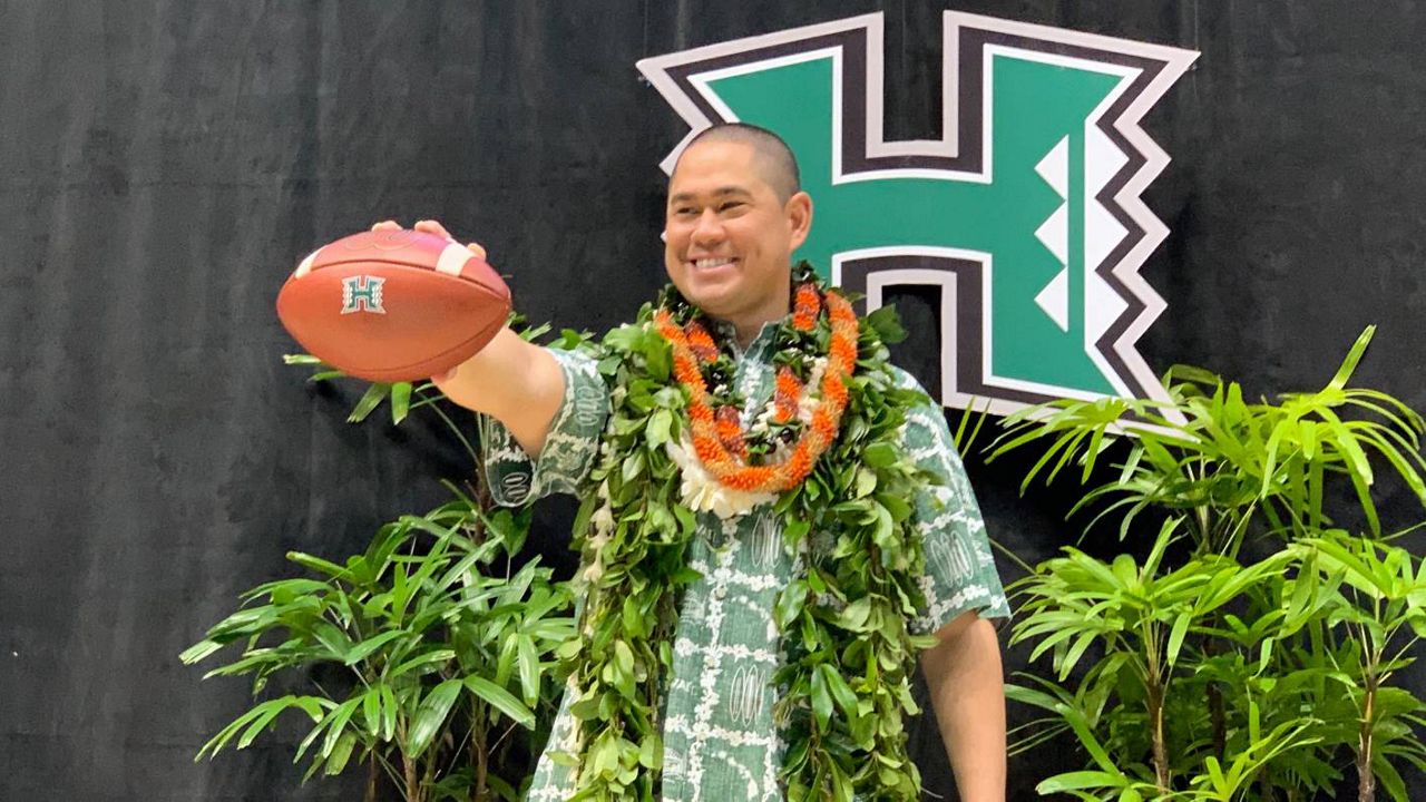 Former Hawaii quarterback Timmy Chang wore a broad smile as he was introduced in person as the new Hawaii football coach on Friday at SimpliFi Arena at Stan Sheriff Center. 