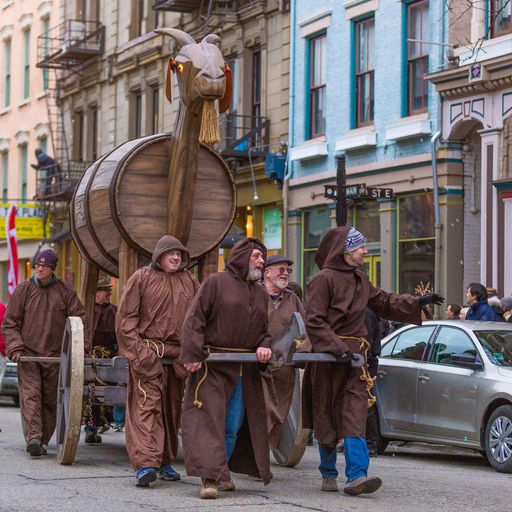 Revelers dressed in monk attire lead the "Trojan goat" during the annual Bockfest parade in downtown Cincinnati. (Provided: Bockfest)