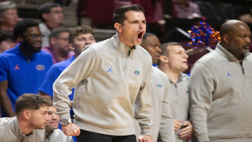 Florida head coach Todd Golden, center, shouts instruction during the first half of an NCAA college basketball game against Florida State in Tallahassee, Fla., Friday, Nov. 15, 2024. (AP Photo/Mark Wallheiser)