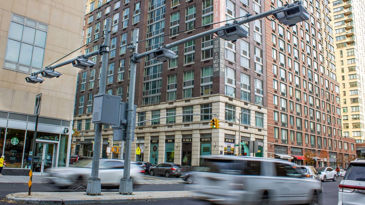 Tolls traffic cameras seen along 61st Street in Manhattan on Nov. 16, 2023. (AP Photo/Ted Shaffrey)