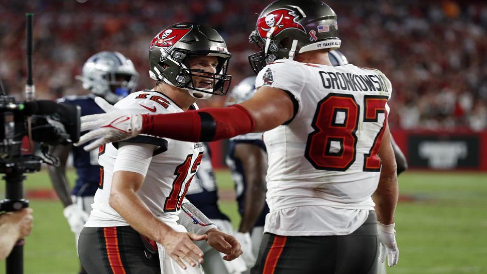 Tom Brady, left, will be without tight end Rob Gronkowski, right, for Sunday's game at New England. (AP file image)