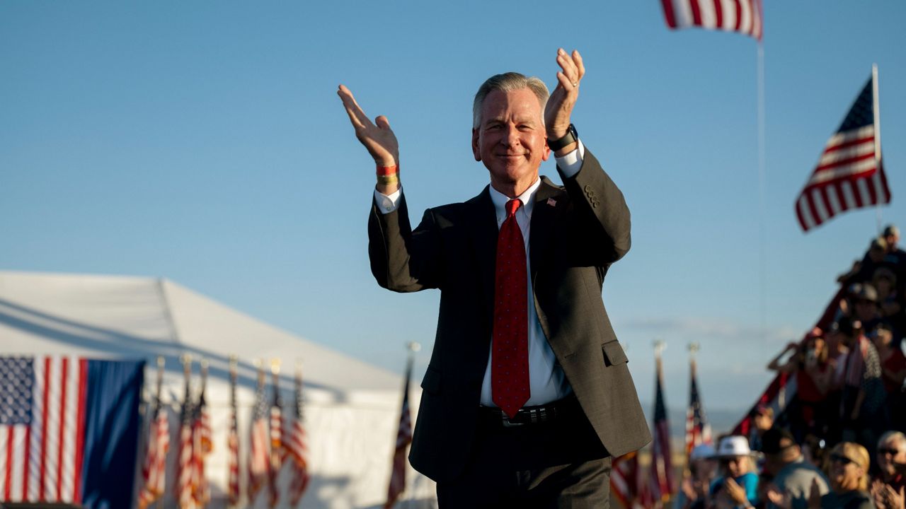 Sen. Tommy Tuberville, R-Ala., is introduced Saturday at a rally for former President Donald Trump at the Minden Tahoe Airport in Minden, Nev. (AP Photo/Jose Luis Villegas)