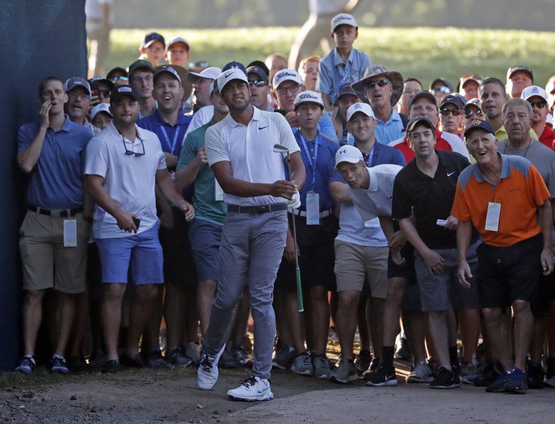 Tony Finau watches his second shot on the 10th hole during the first round of the PGA Championship golf tournament at Bellerive Country Club, Thursday, Aug. 9, 2018, in St. Louis. (AP Photo/Jeff Roberson)