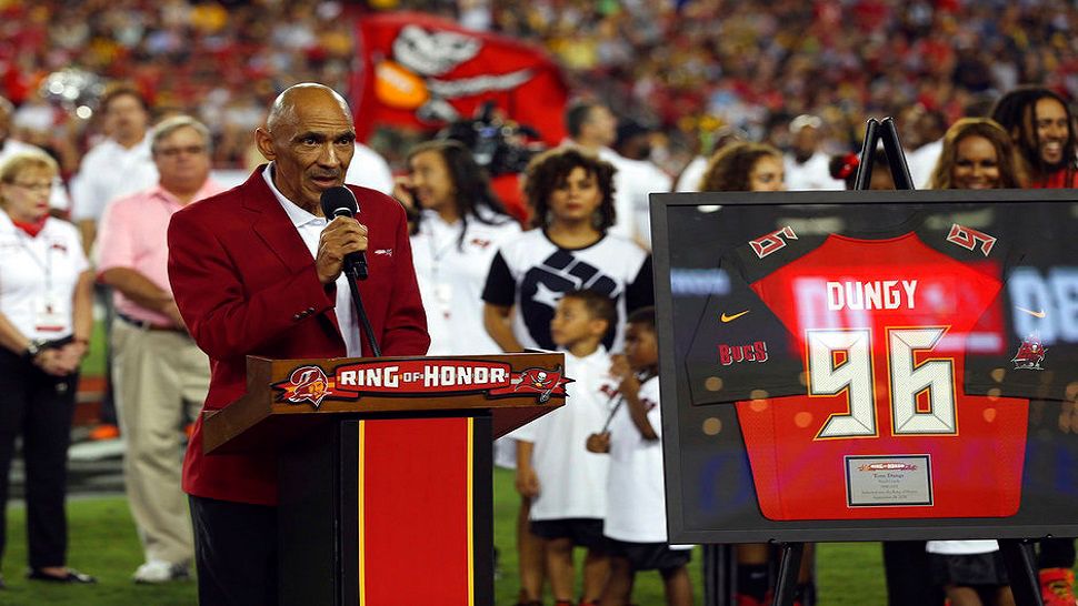 Former Tampa Bay Buccaneers head coach Tony Dungy speaks to the fans after being inducted in the team's Ring of Honor during halftime of an NFL football game against the Pittsburgh Steelers Monday, Sept. 24, 2018, in Tampa, Fla. (AP Photo/Mark LoMoglio)