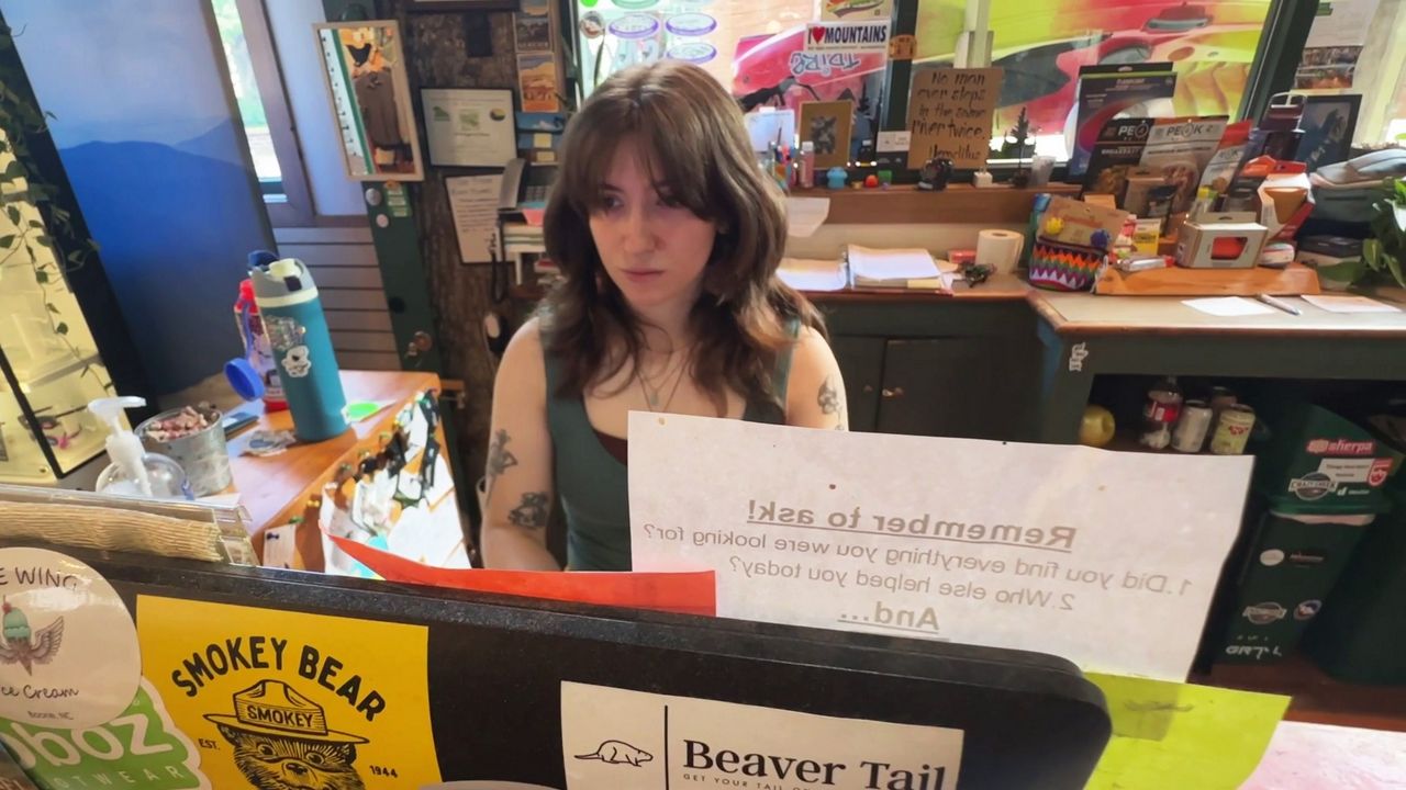 Tori Soden works at Footsloggers, an outdoor gear store that has been in Boone since 1971. (Spectrum News 1/Rose Eiklor)