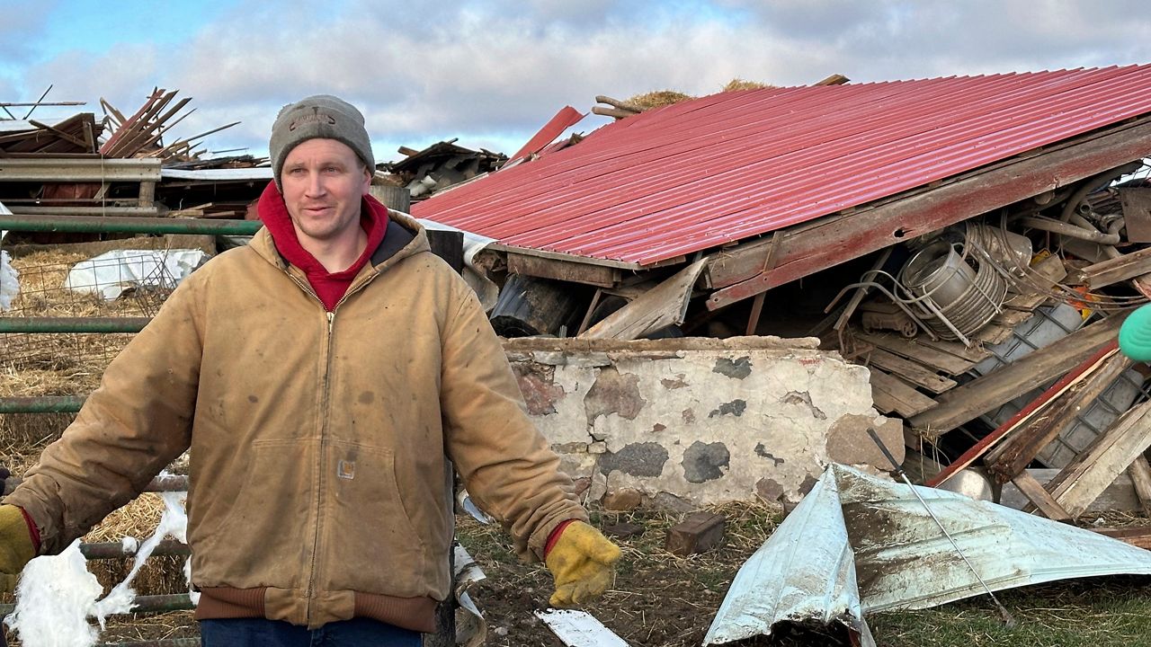 Matt Artis, 34, surveys the wreckage Friday morning