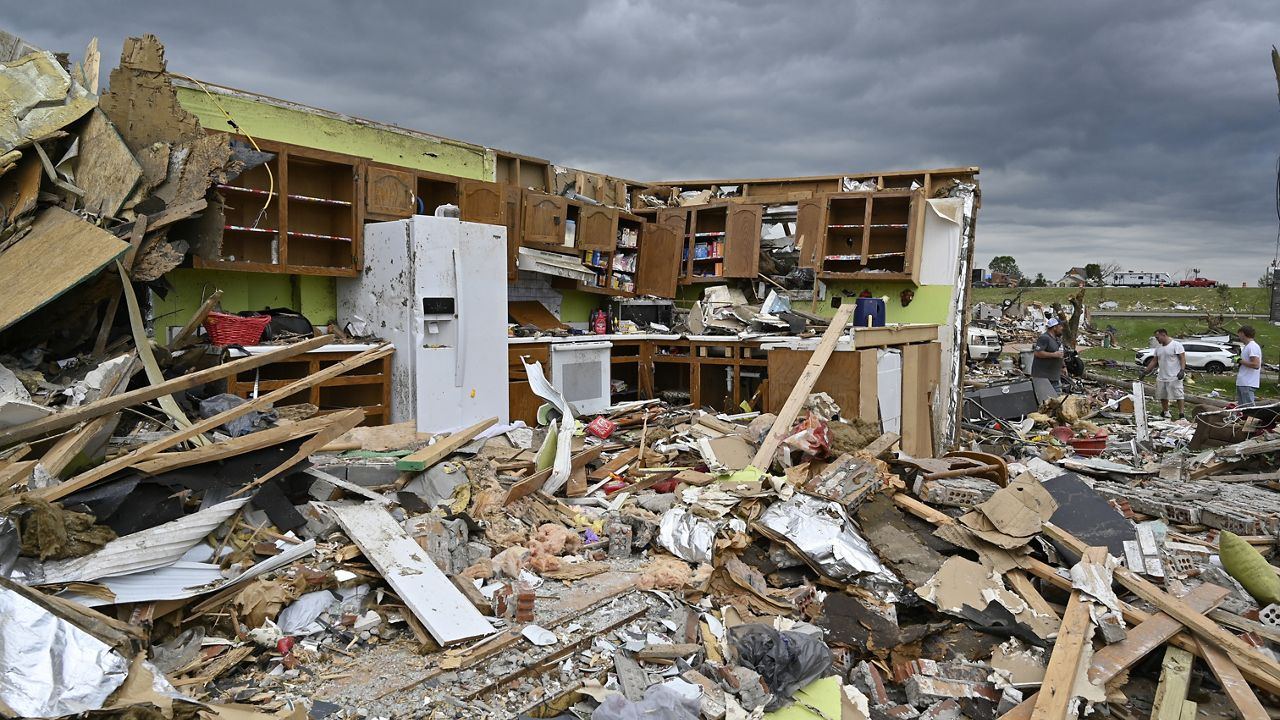 The remains of a kitchen surrounded by debris after severe storms in the Sunshine Hills neighborhood in London, Ky., Monday, May 19, 2025. (AP Photo/Timothy D. Easley)