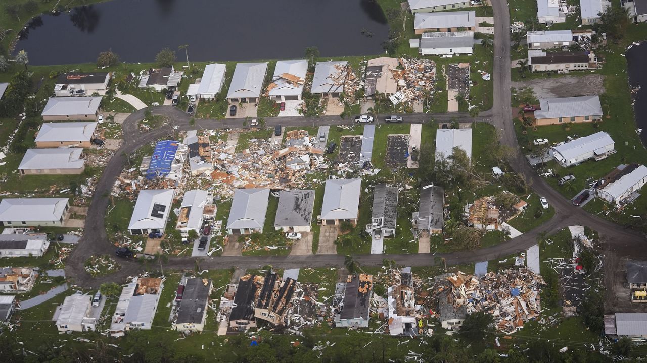 Neighborhoods with debris from tornadoes are visible in the aftermath of Hurricane Milton, Oct. 10, 2024, in Fort Pierce, Fla. (AP Photo/Gerald Herbert)