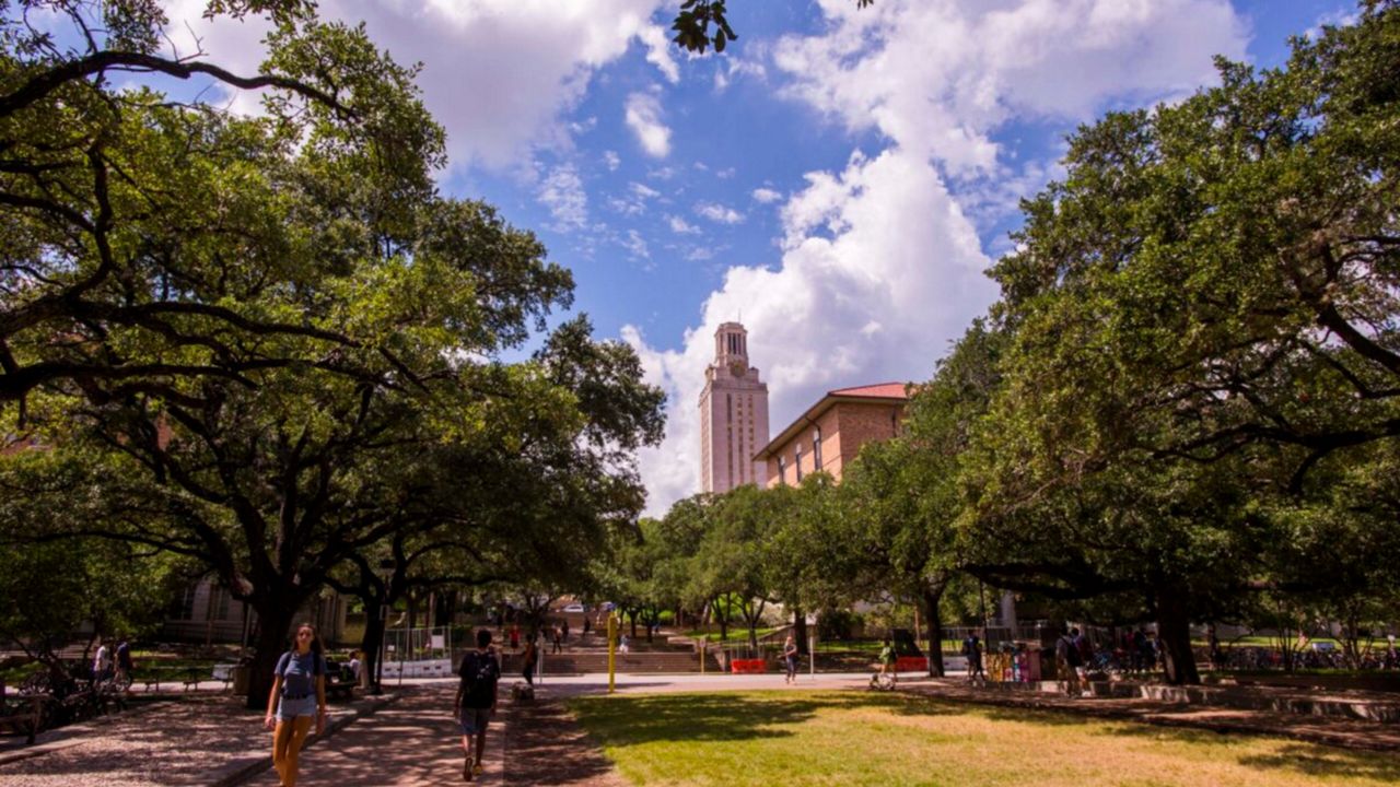 Clouds form over the University of Texas at Austin as students are seen strolling. (UT Austin) 