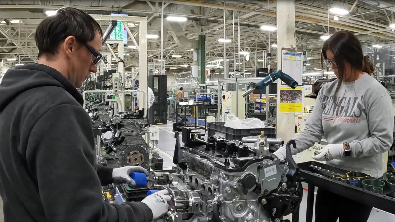 Assembly line workers put together an engine on the Turbo Flex line at the Toyota plant in Georgetown, Ky. (Toyota Motors)