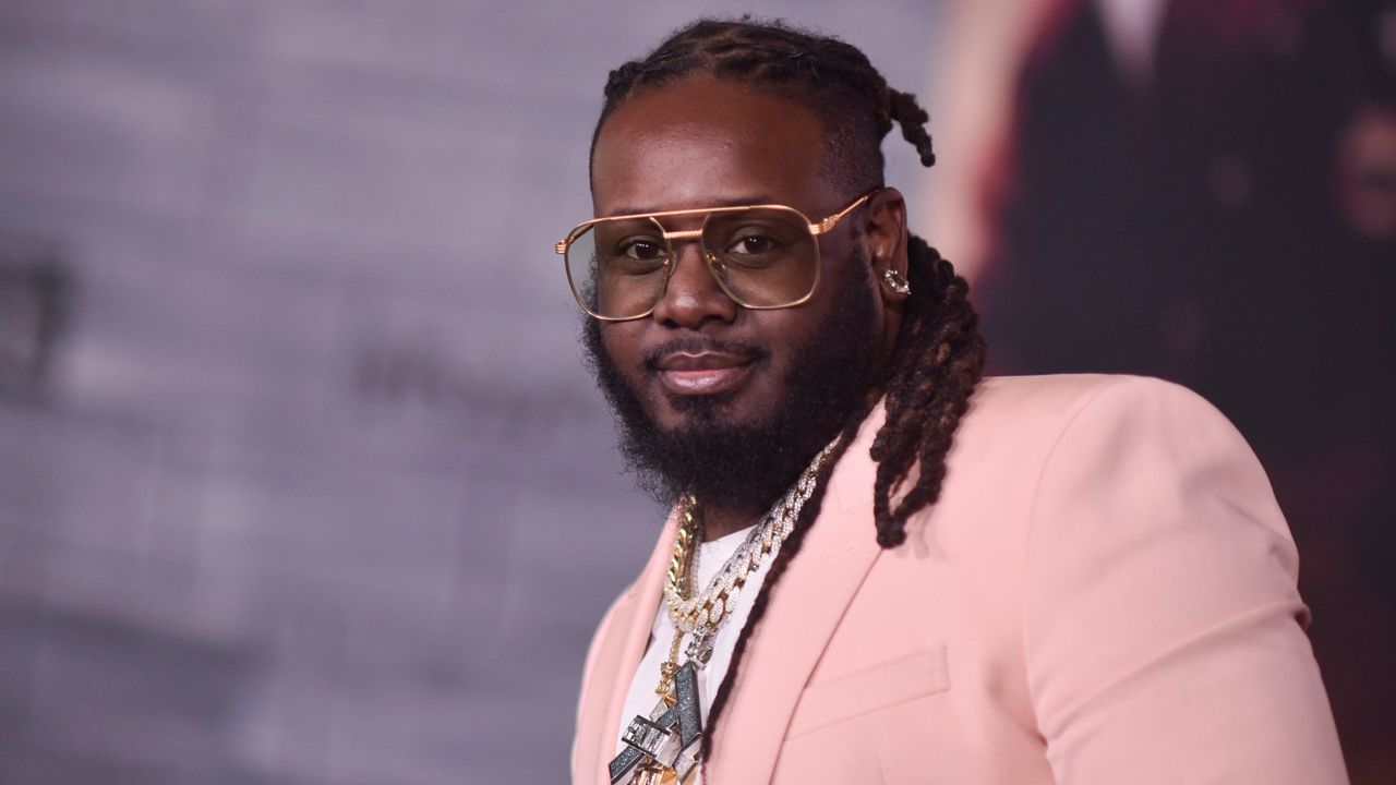T-Pain attends the LA premiere of "Bad Boys for Life" on Jan. 14, 2020, in Los Angeles. T-Pain's new book, “Can I Mix You a Drink?” co-written with professional cocktail expert Maxwell Britten, is filled with 50 alcoholic drink recipes inspired by Pain’s music and career travels. (Photo by Richard Shotwell/Invision/AP, File)