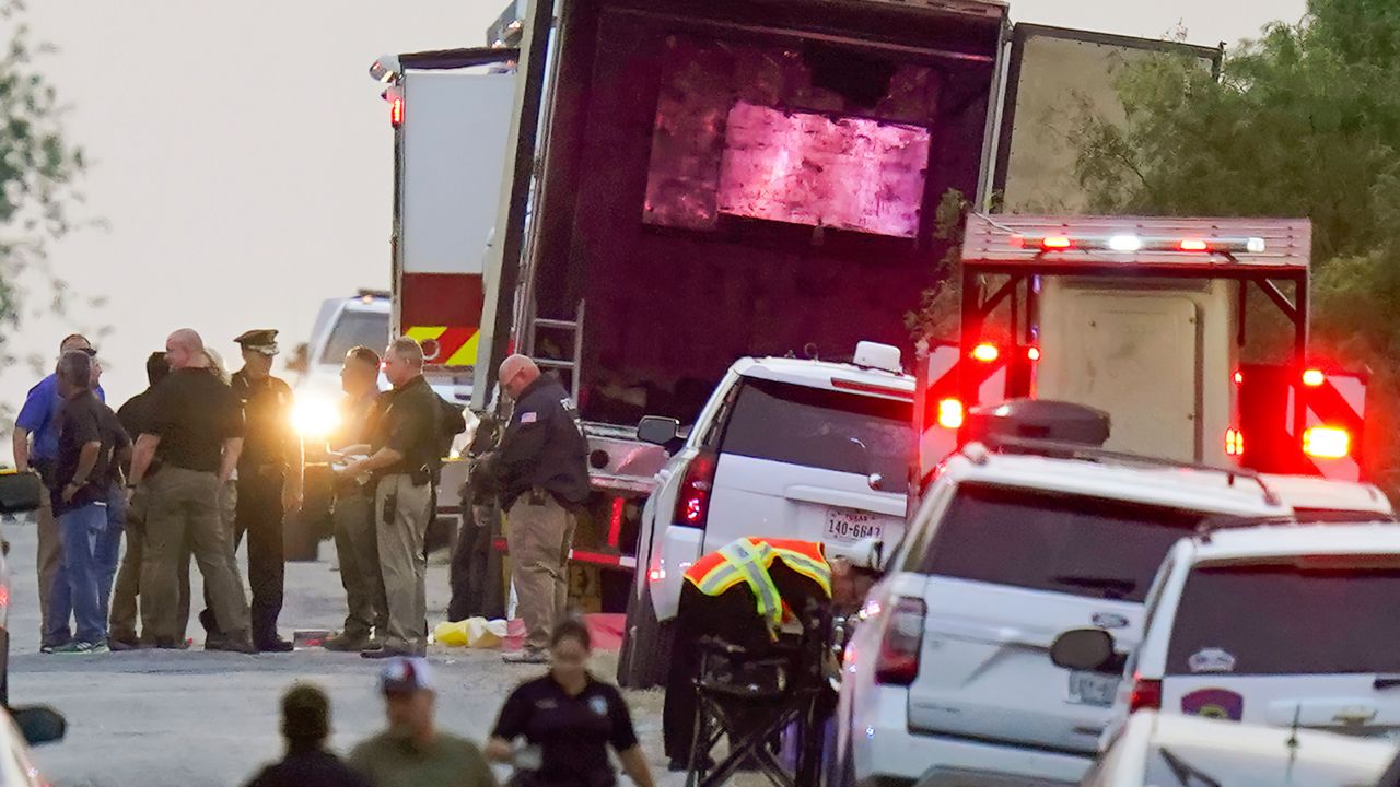 Police and other first responders work the scene where officials say dozens of people have been found dead and multiple others were taken to hospitals with heat-related illnesses after a tractor-trailer containing suspected migrants was found on June 27, 2022, in San Antonio. (AP Photo/Eric Gay, File)
