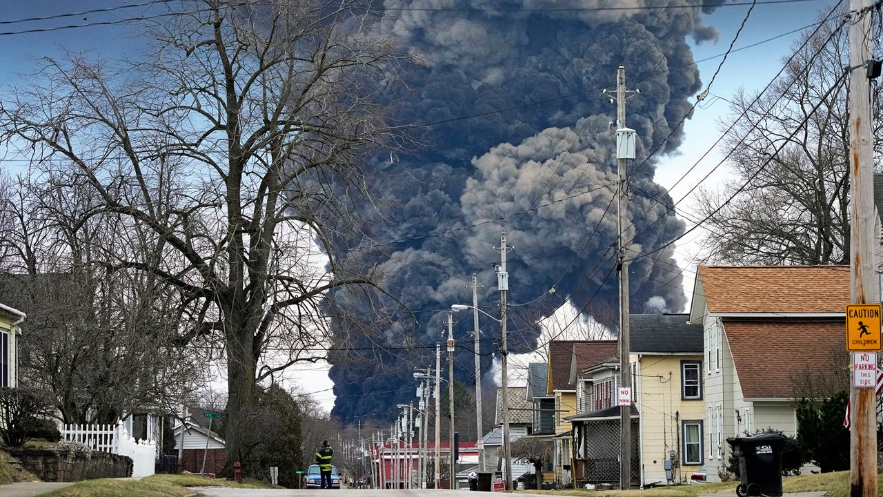 A black plume rises over East Palestine, Ohio, as a result of the controlled detonation of a portion of the derailed Norfolk and Southern trains Monday, Feb. 6, 2023. (AP Photo/Gene J. Puskar)