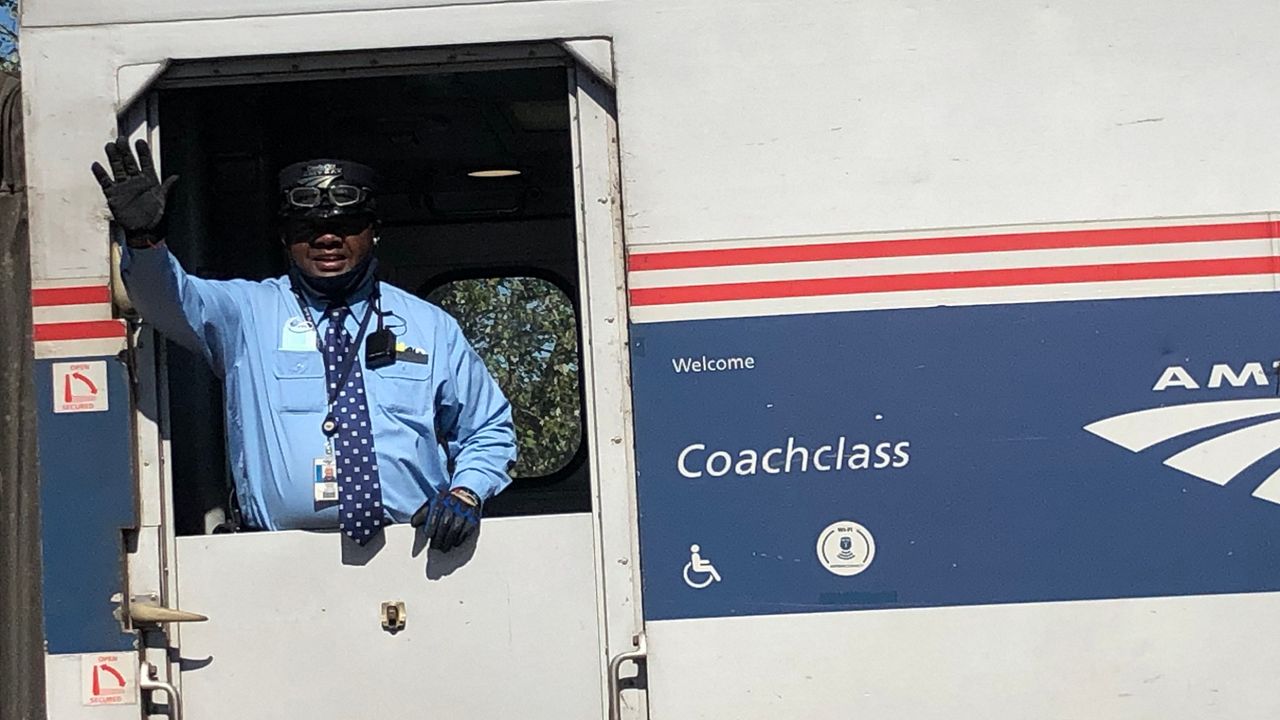 A train employee waves as the Missouri River Runner pulls out of a station along the 283-mile cross-state route. (Provided: Tammy Bruckerhoff, director of Tourism and Economic Development for the city of Hermann)