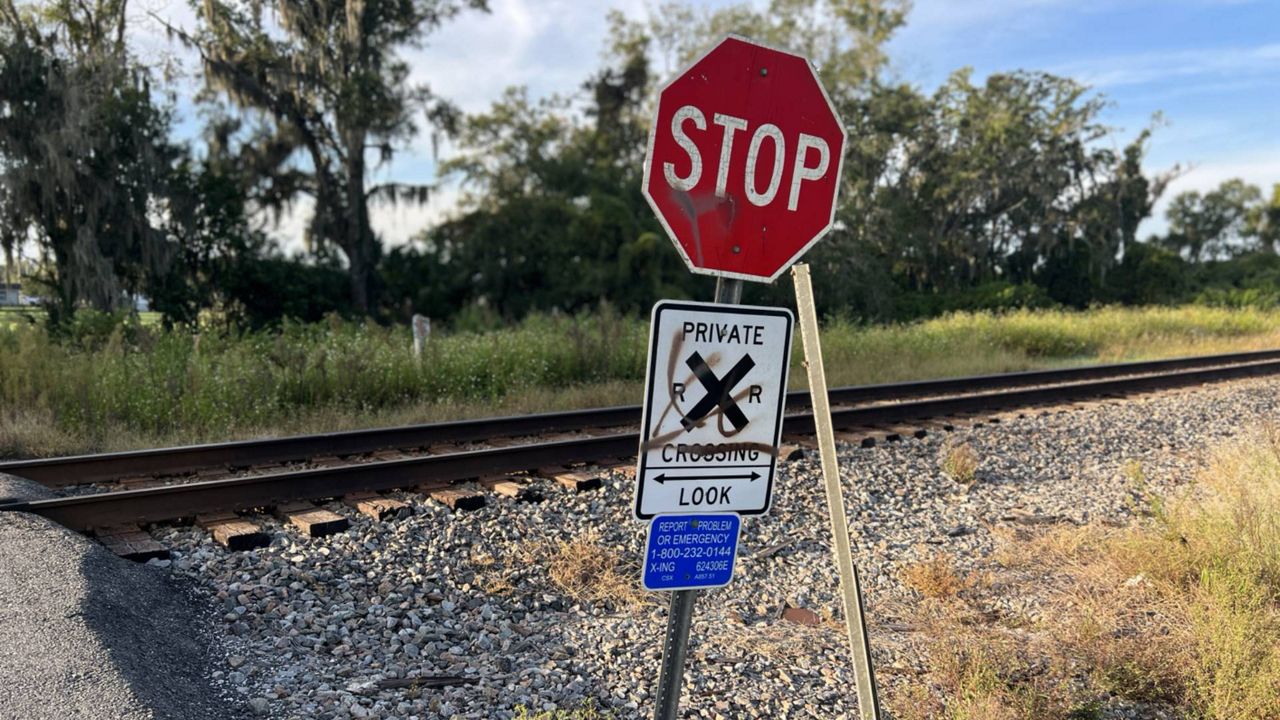 The railroad crossing where the incident occurred does not have a signal light or any crossing arms, but there is a stop sign posted. Hillsborough County Sheriff's officials are still investigating as to why the driver did not stop. (Spectrum News/Brian Rea)