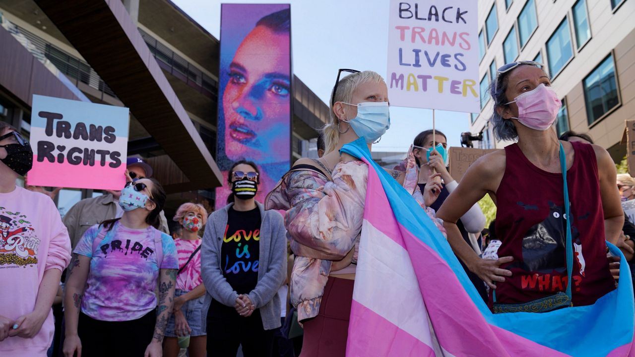 Pro-transgender demonstrators hold a protest outside the Netflix building on Vine Street in the Hollywood section of Los Angeles on Oct. 20, 2021. (AP Photo/Damian Dovarganes, File)