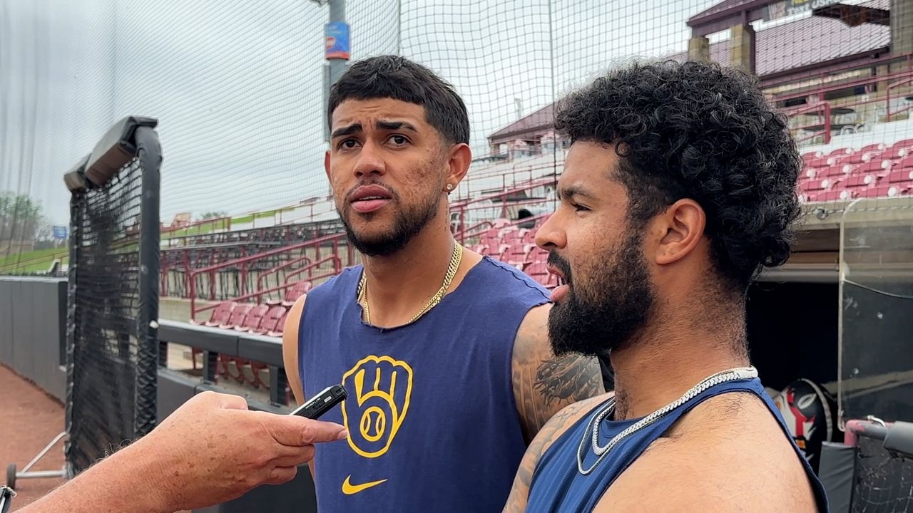 Eduardo Garcia (left) and Hedbert Perez (right) doing interviews