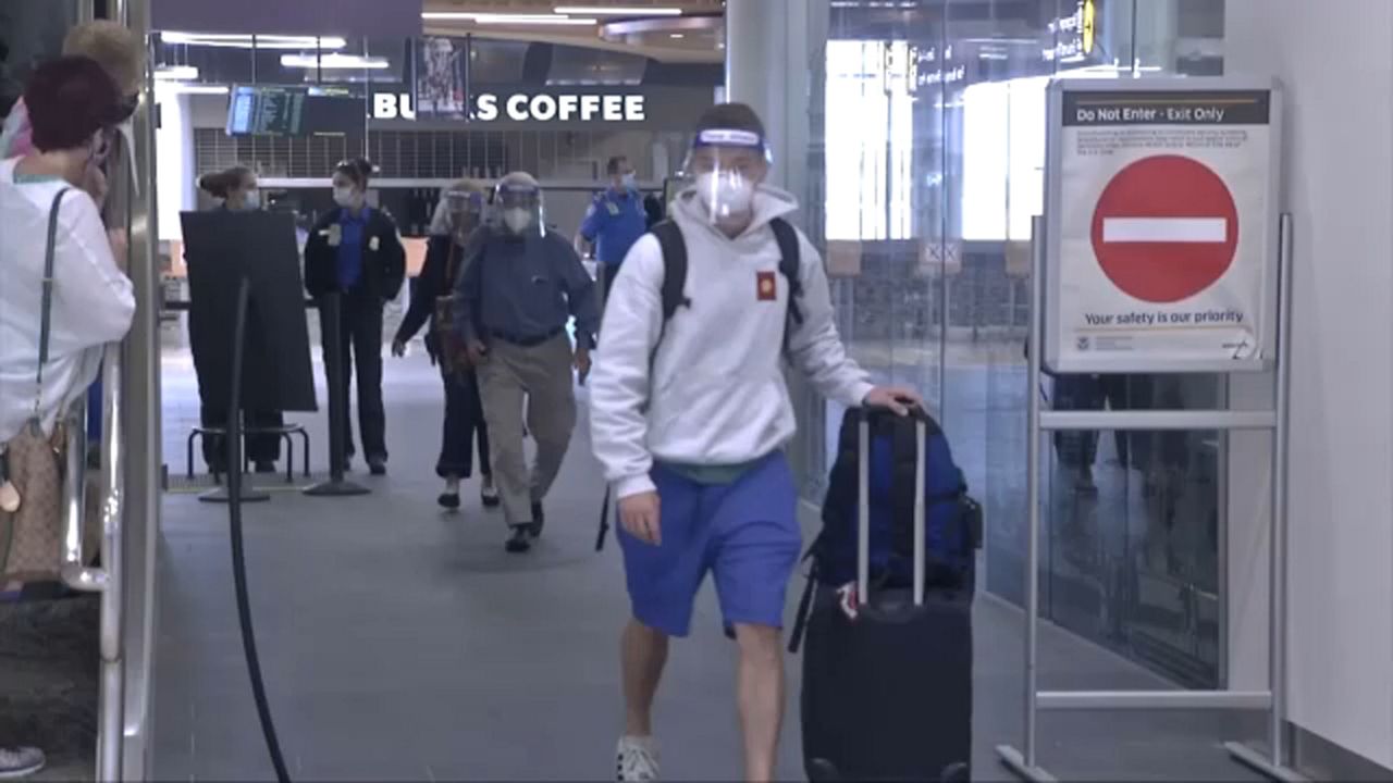 Passengers in airport walking to gate