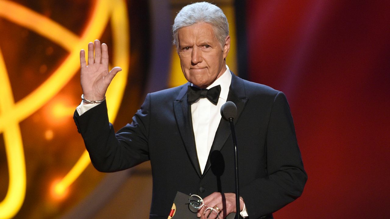 This May 5, 2019, file photo shows Alex Trebek gestures while presenting an award at the 46th annual Daytime Emmy Awards in Pasadena, Calif. (Photo by Chris Pizzello/Invision/AP, File)