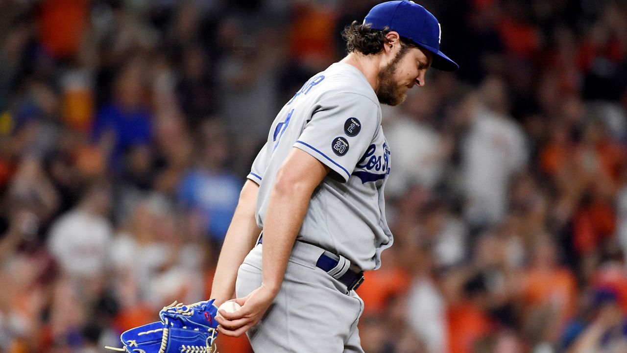 In this May 26, 2021, file photo, Los Angeles Dodgers starting pitcher Trevor Bauer walks back to the mound after giving up a solo home run to Houston Astros' Carlos Correa in the sixth inning of a baseball game in Houston. (AP Photo/Eric Christian Smith)