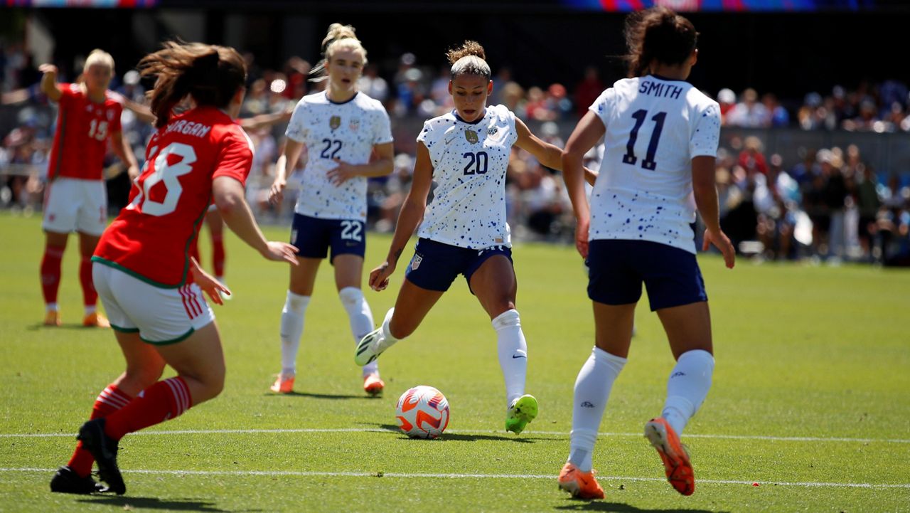 trinity rodman lining up her shot on goal against wales