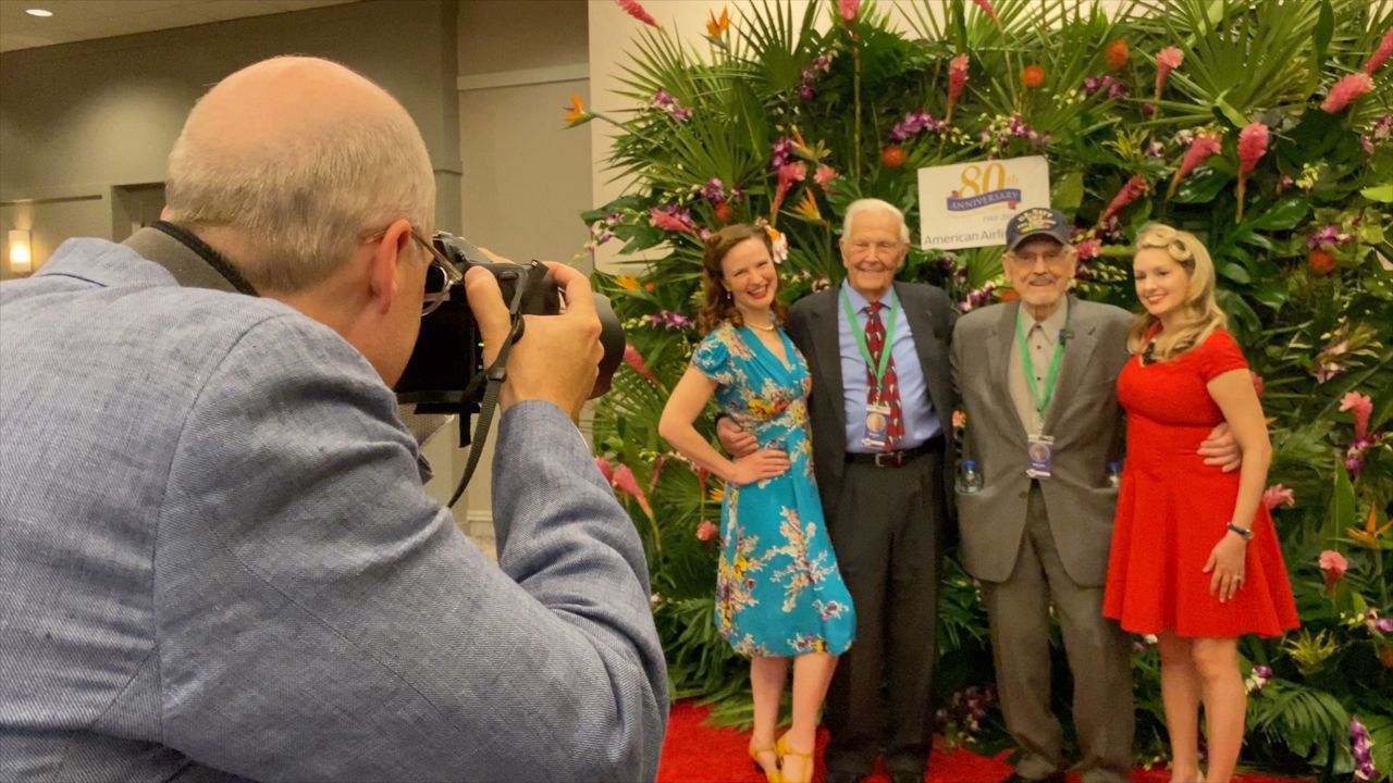 Brothers Walter and Jack Stowe smile for a picture at Dallas/Fort Worth International Airport before taking a commemorative trip to visit Pearl Harbor. (Spectrum News 1/Lupe Zapata)