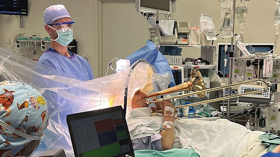  Brian Rust hopes his story will raise awareness of deep brain stimulation and its benefits for tremor patients, while continuing to perform with his band.